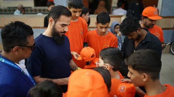 charity workers looking after young adults